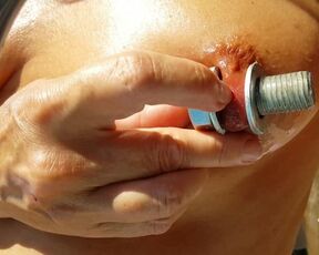 Nippleringlover Inserting Huge Screws in Stretched Nipple Piercings Nude Outdoors - Big Labia Ring