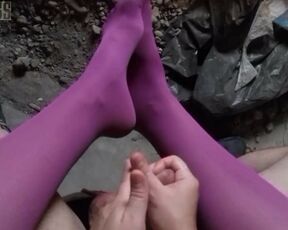 POV video of NightMiss feet in purple pantyhose giving sloppy handjob