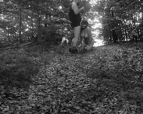 Naked submissive slut taken for a walk on a leash in forest