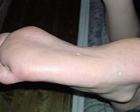 Eating cum off her oiled soles