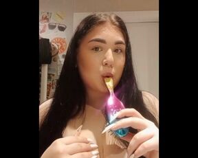 beautiful girl licks her hairbrush juicy.